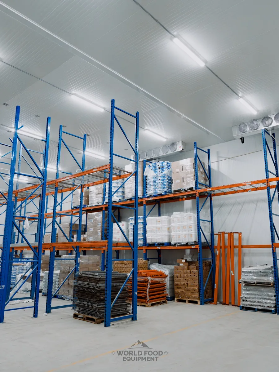 Custom cold-storage room with pallet racking and ceiling-mounted refrigeration.