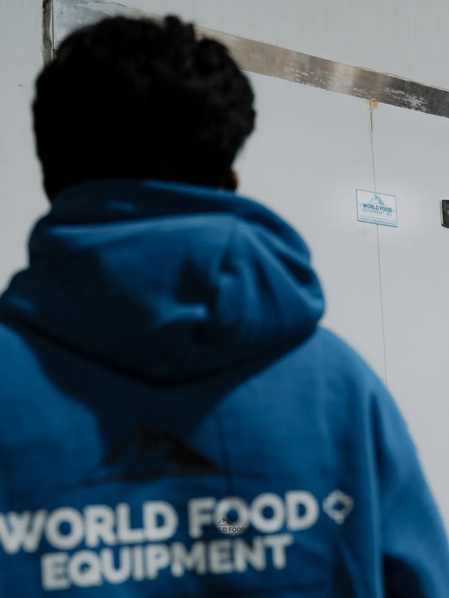ThermoFreeze crew member in front of a finished commercial cold storage installation.